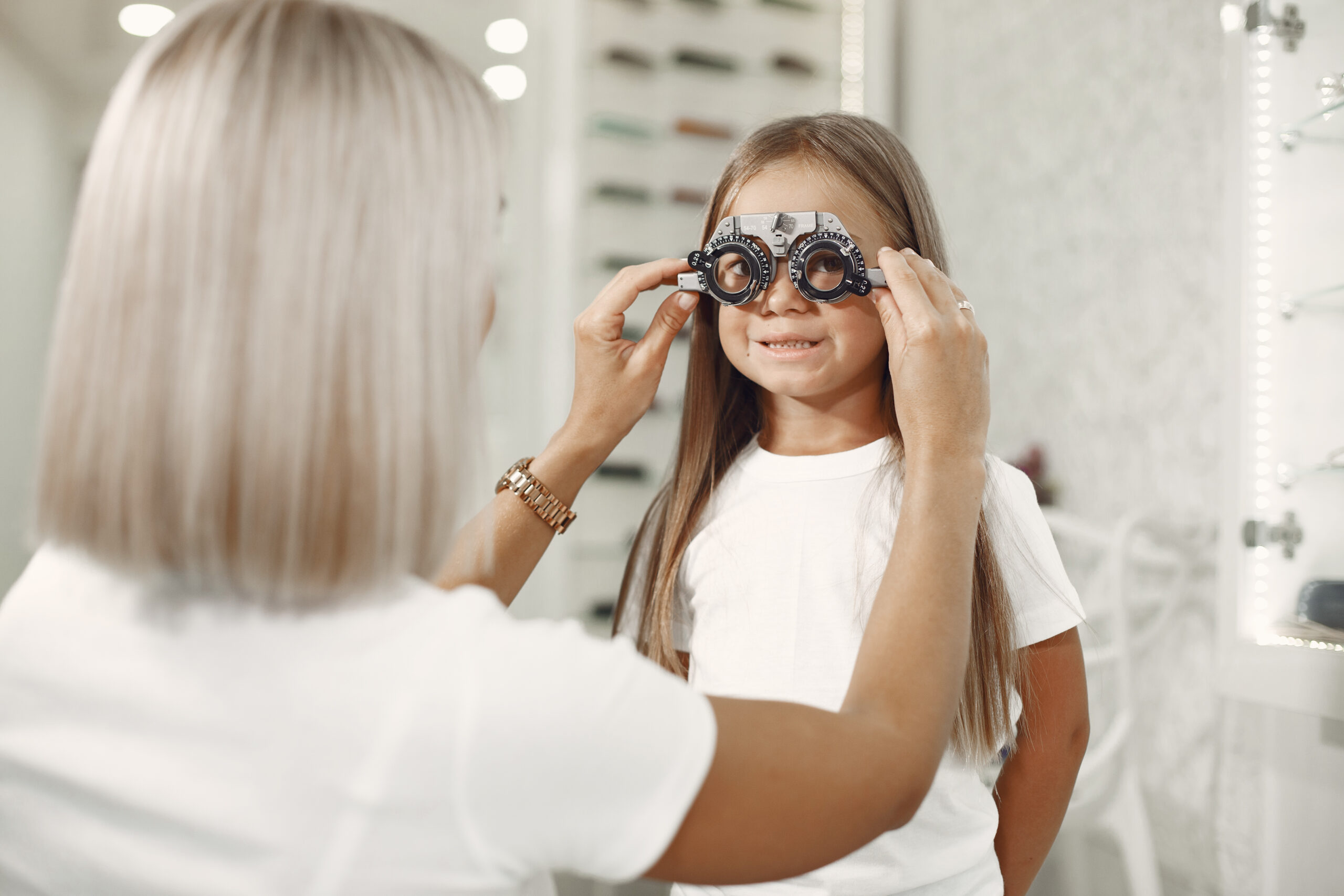 child in a glasses store check his eyes child in a glasses store check his eyes